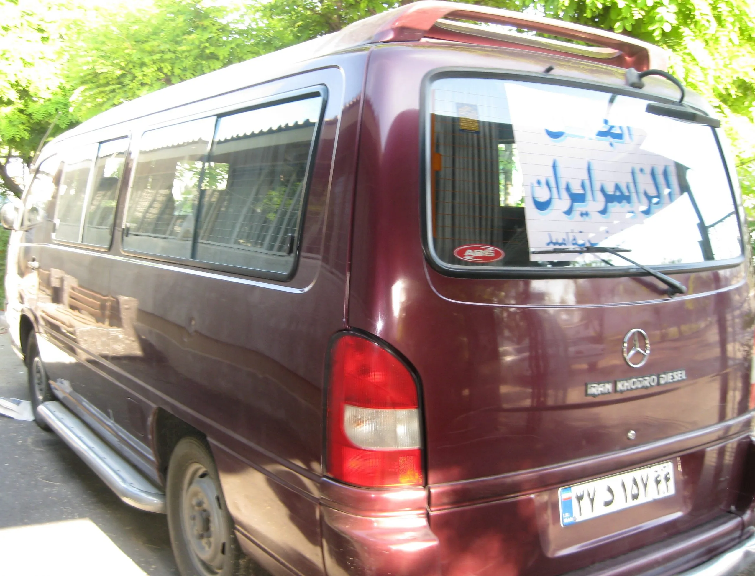 The minibus used to bring patients to the day centre, with the association's sign in the rear window