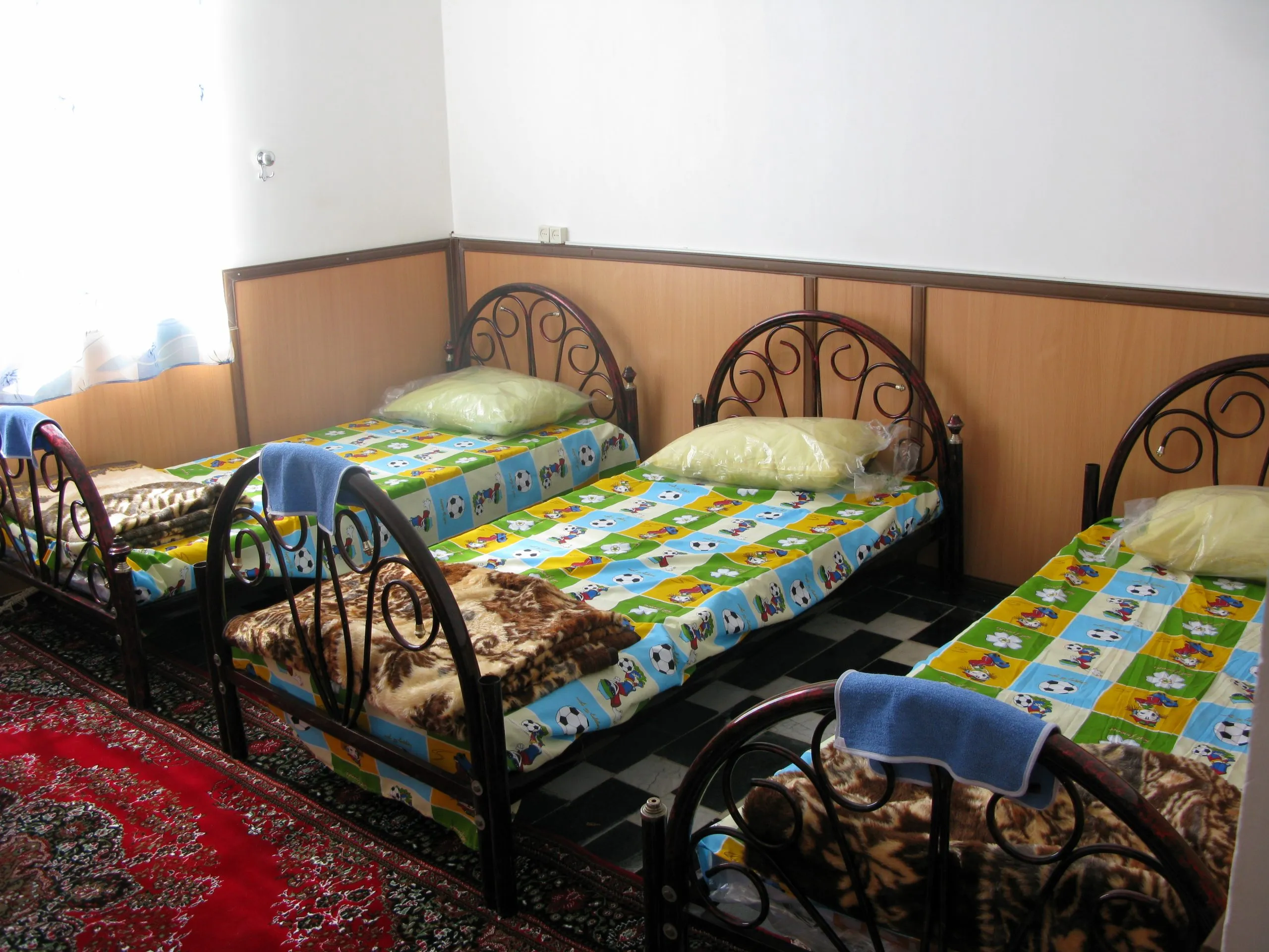 Three beds with new pillows and sheets