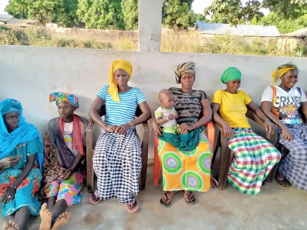 Women sitting with their kids