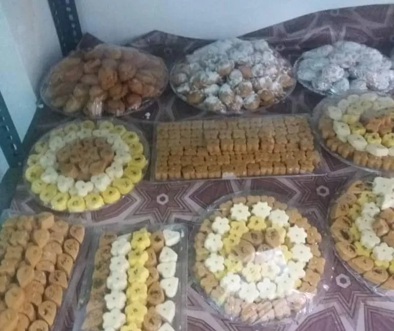 Trays of home-made biscuits and pastries packed and laid out ready for sale