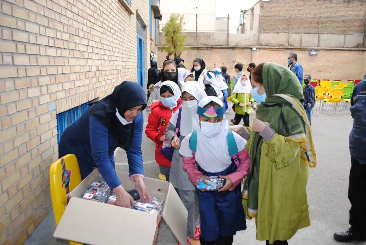 Kids in the school yard grabbing school supplies