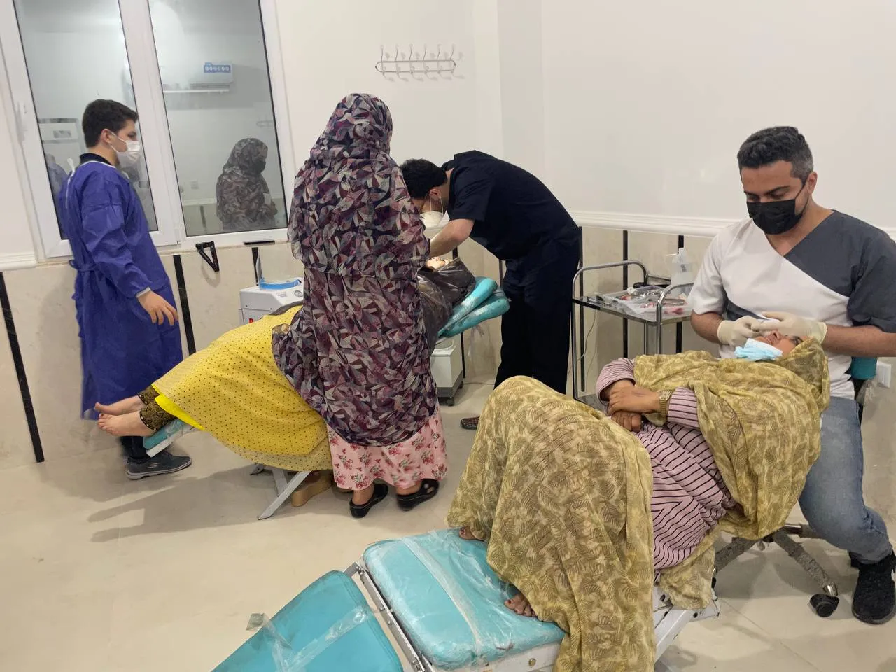The dental treatment room at the Goori clinic, with patients being treated by two dentists