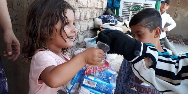 Mahmoodabad-children-getting-some-stuff1